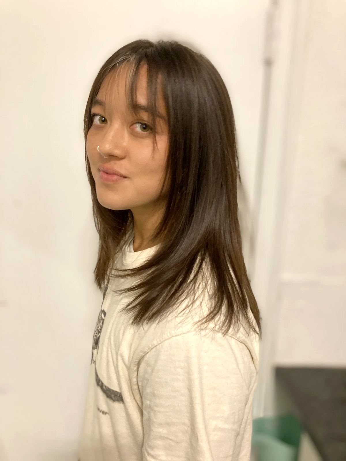 Medium dark hairstyle with bangs