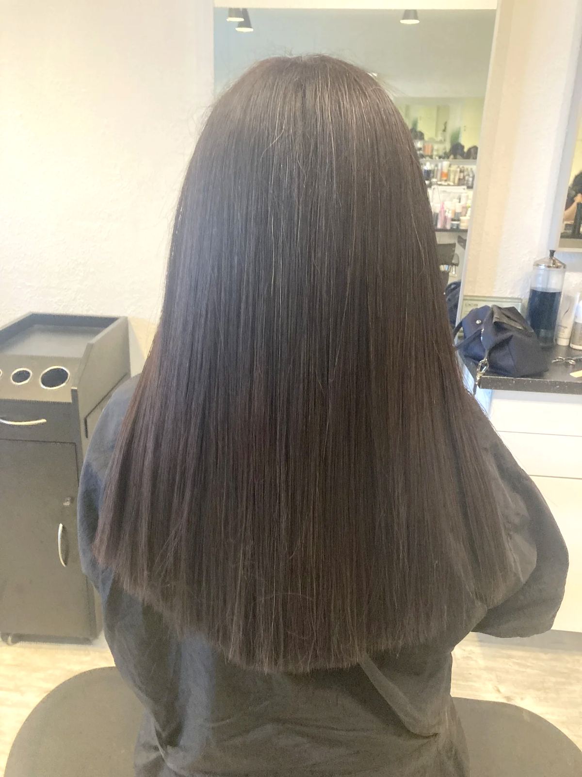 Long sleek dark brown blunt cut