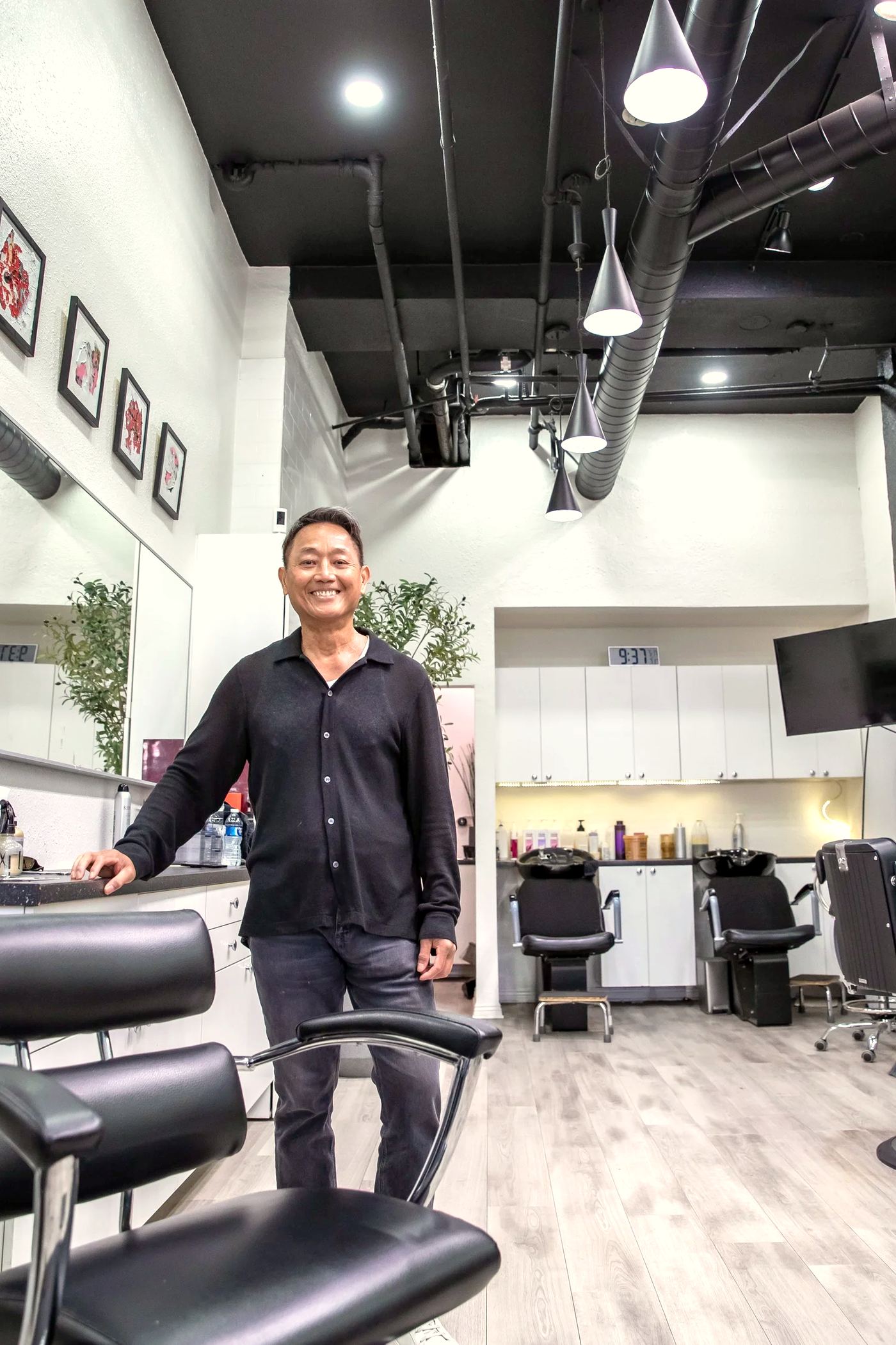 Sana Lim standing in his modern Pasadena salon